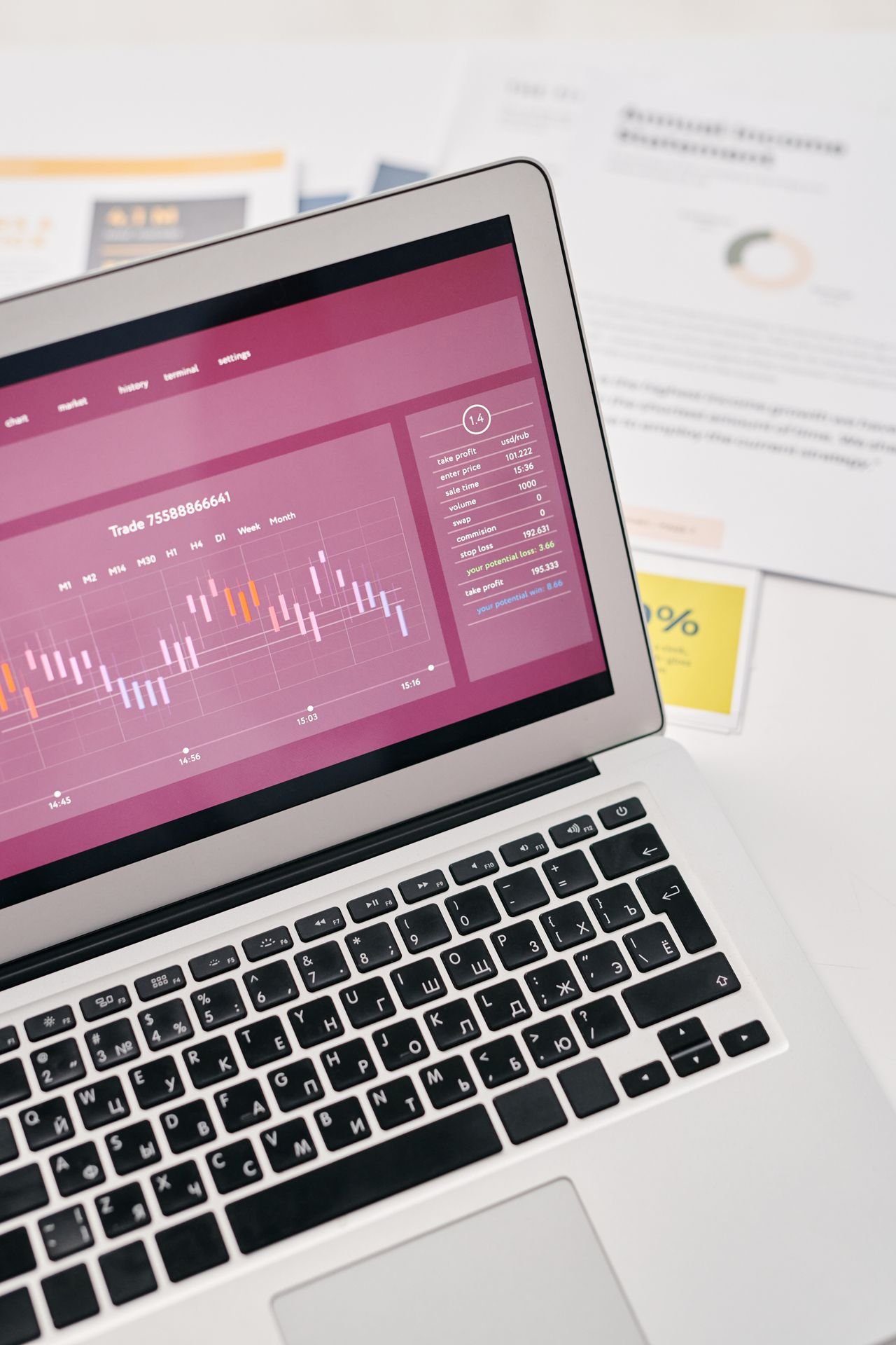 Laptop showing marketing graphs comparing Google Ads and SEO results for a dental practice