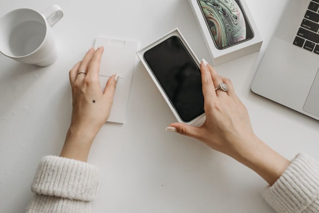 Person holding a smartphone reading online reviews of a dental practice