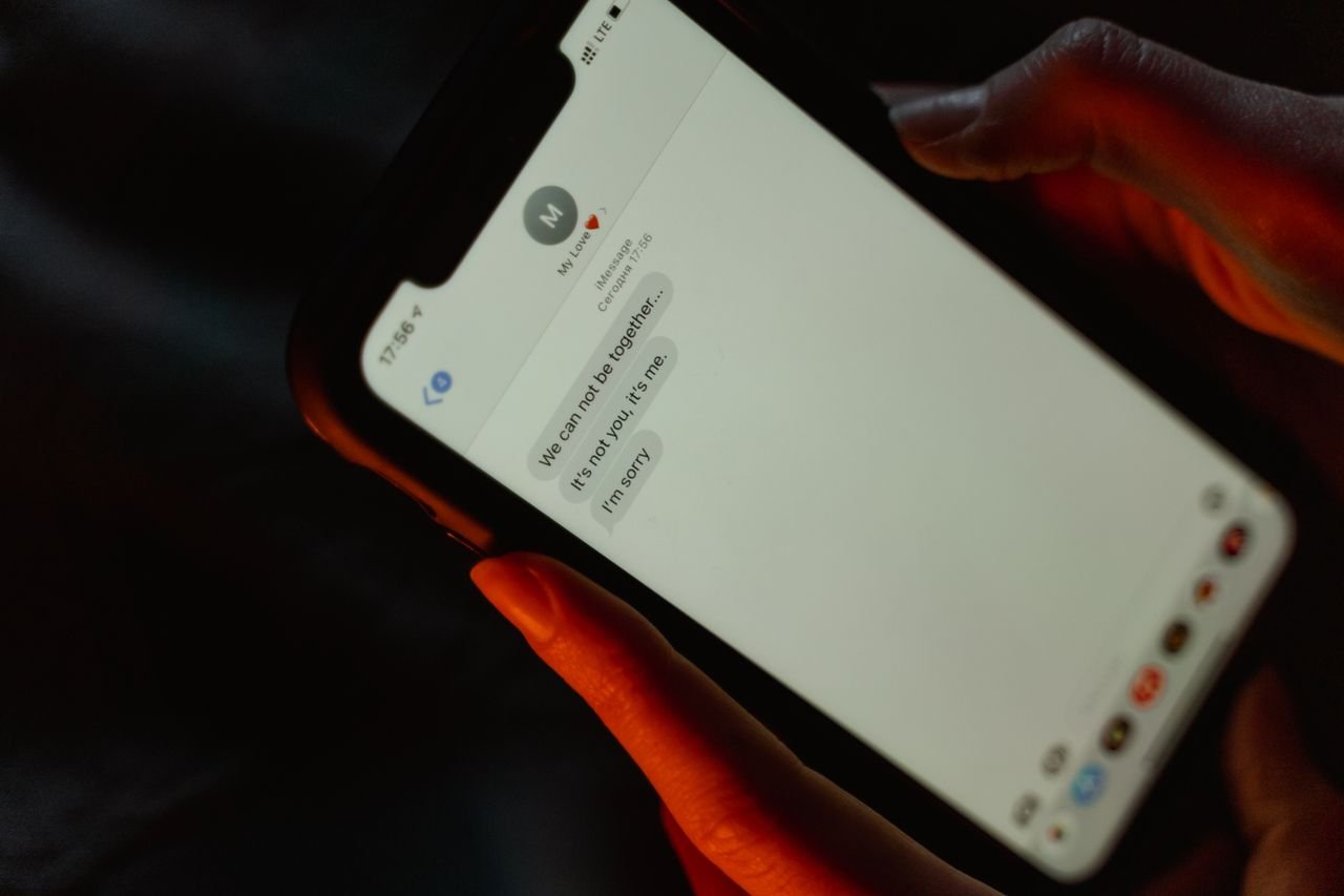 Person reading a text message on a smartphone